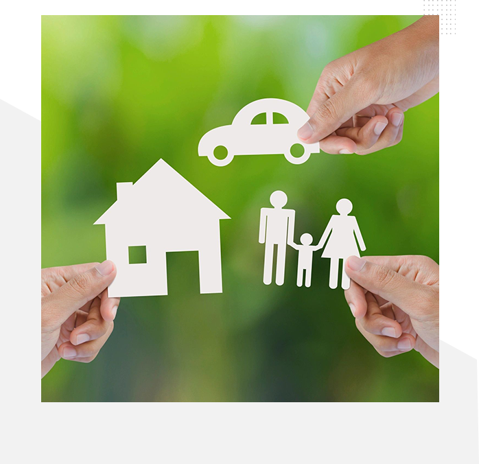 A group of people holding paper cut outs with a car, house and family.